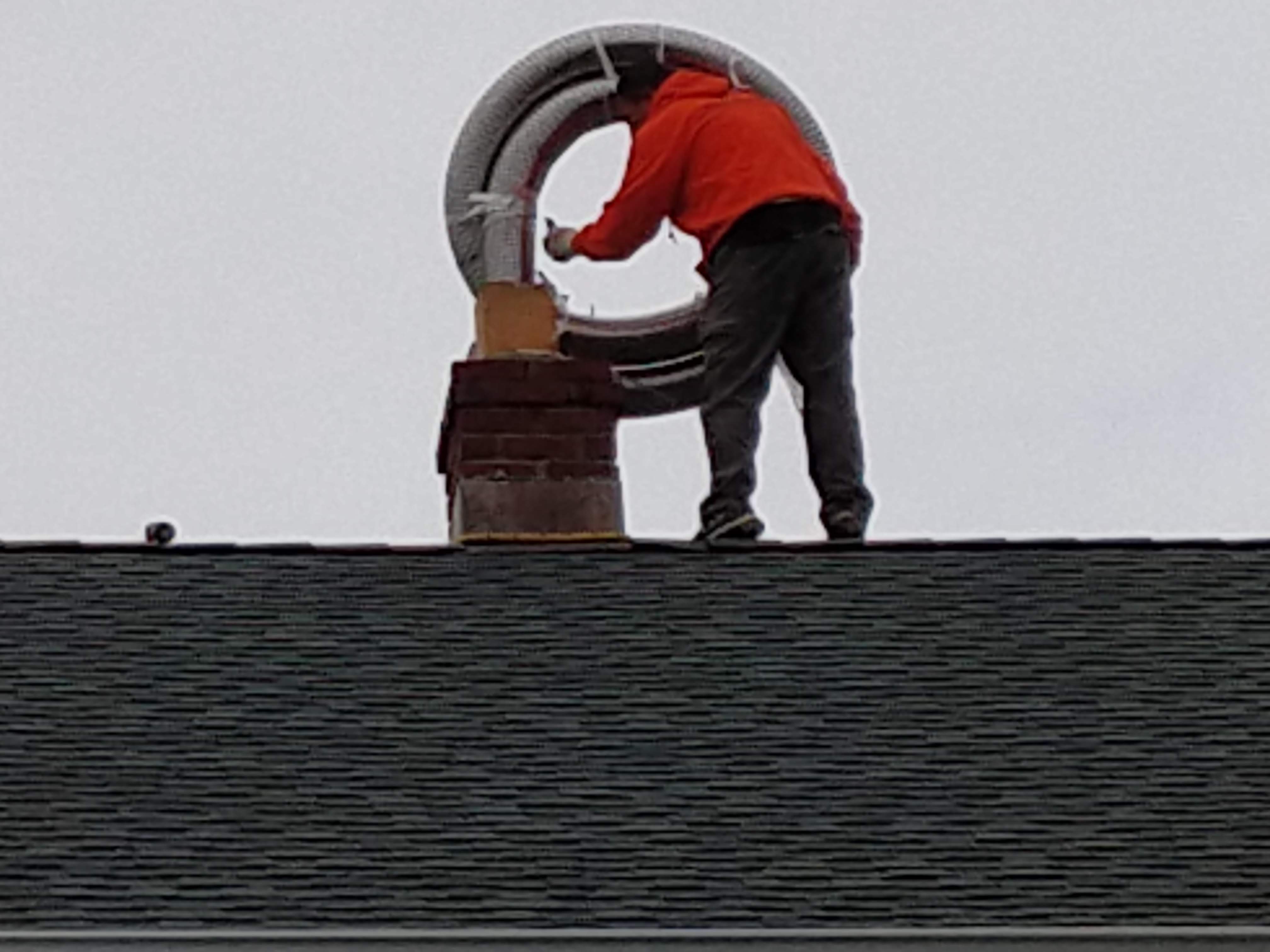 Flexible stainless chimney liner being installed in Brentwood, New York