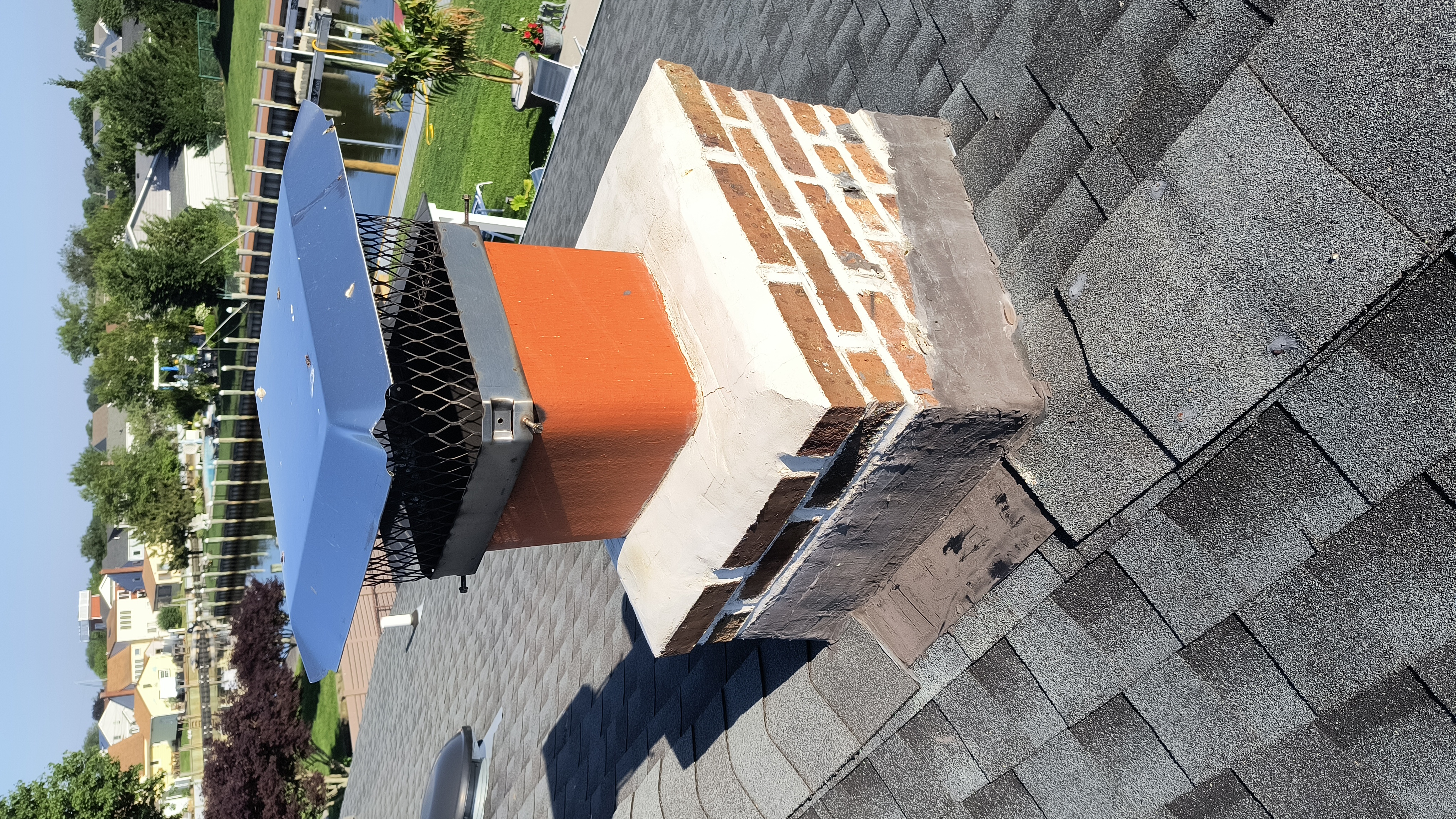 Full chimney masonry rebuild and restoration in Brentwood, NY
