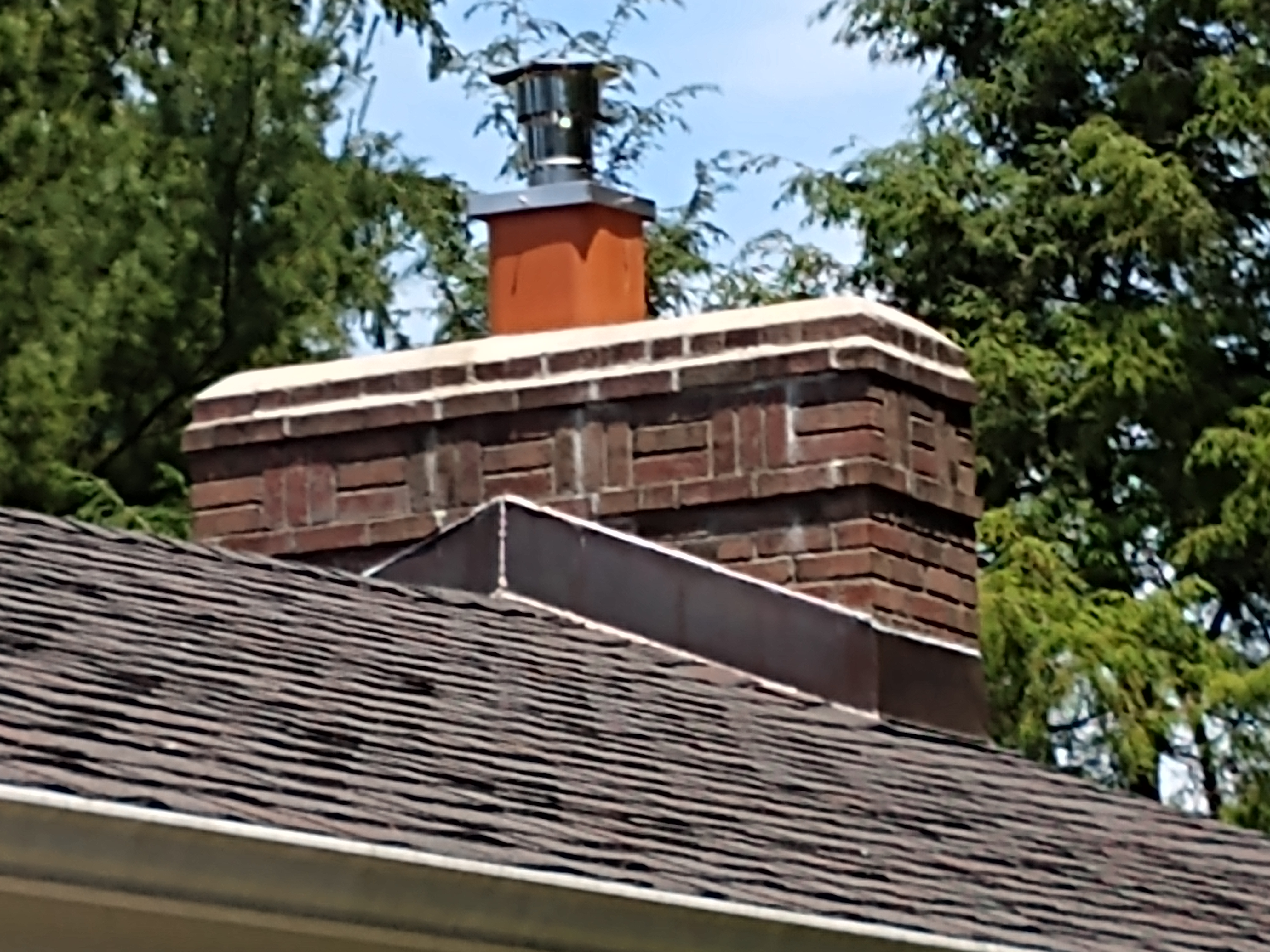 Stainless steel chimney cap with animal guard in Brentwood, New York